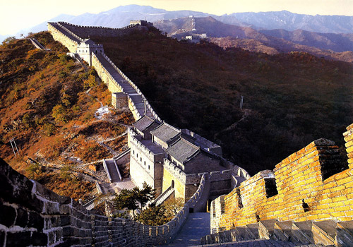 The Mutianyu Great Wall is surrounded with golden plants in autumn.
