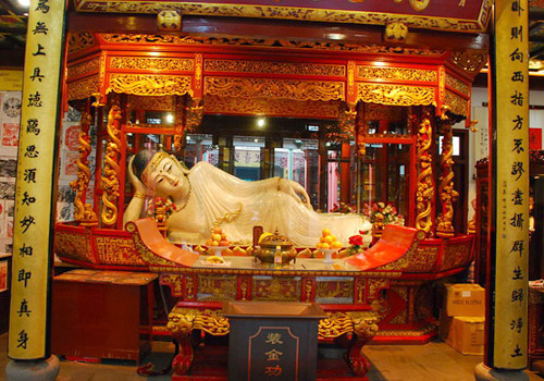 The sitting Buddha is carved from the whole sparkling and crystal-clear white jade.