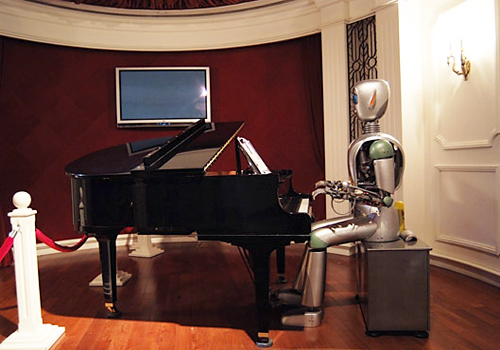 A robot is playing the piano in Shanghai Science and Technology Museum. 