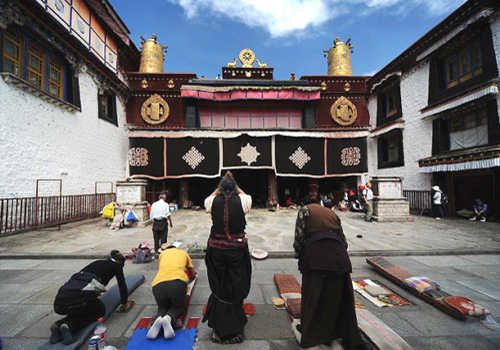 Kowtowing in front of Jokhang Temple is still a religionary tradition of the pious worshipers.