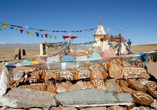Religious prayer stones and flags at the lakeshore,Tibet