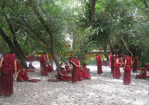 Lamas of Drepung Monastery are debating sutras.