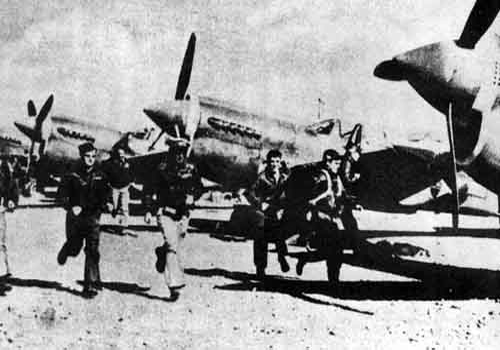 An old picture of the Flying Tigers and the P 40 fighter planes.