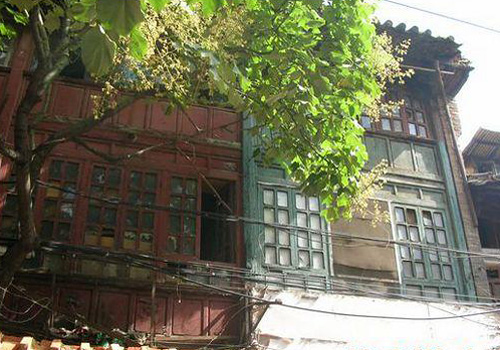 Two painted old houses at Jingxing Flowers and Bird Market in Kunming.