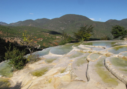 Located at the foot of Haba Snow Mountain, 103 kilometres away from Shangri-la, and rising 2,380 metres above the sea level, Baishui Terrace is a marvelous geological sight because it was formed as calcium carbonate dissolved in the spring.
