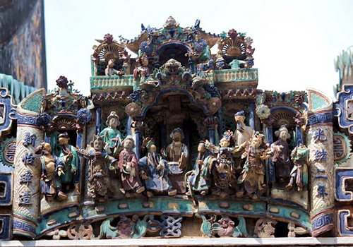 The exquisite and vivid Shiwan Figures carved in glazed tiles on the eaves of the hal in Kum Iam Temple, Macao
